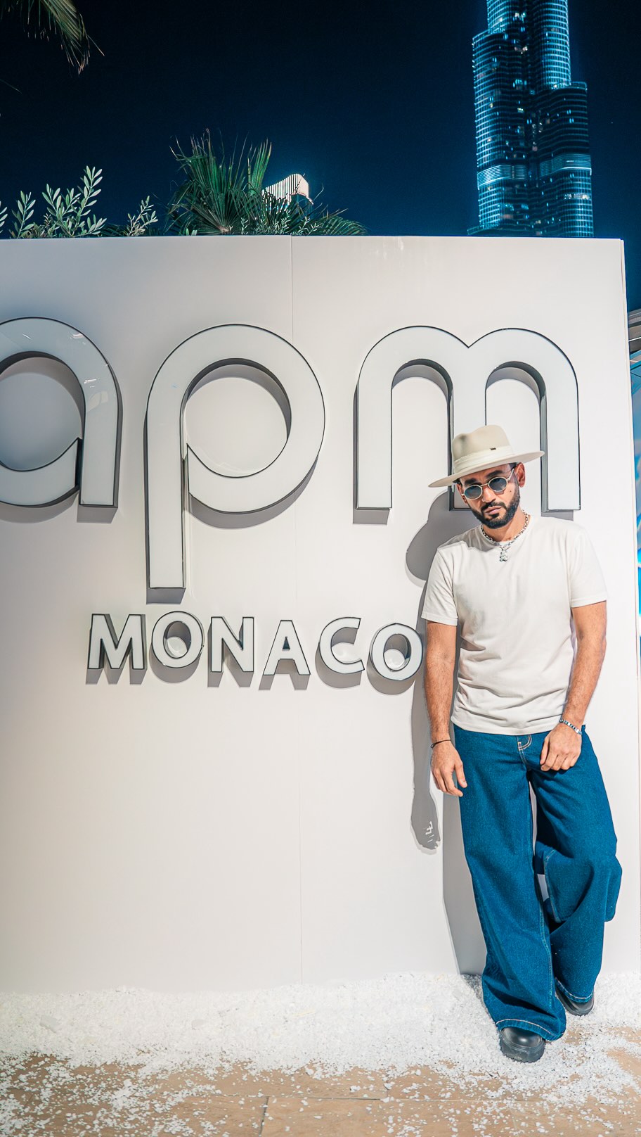 Instagram post by @djbliss for APM Monaco. Caption reads: @apmmonaco #TheKidFromDubai 🧸.