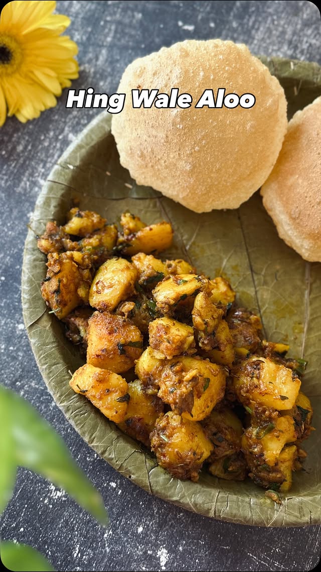 Instagram post by @ritisrasoi for Catch Foods. Caption reads: Hing wale aloo — simple recipe, but full of....