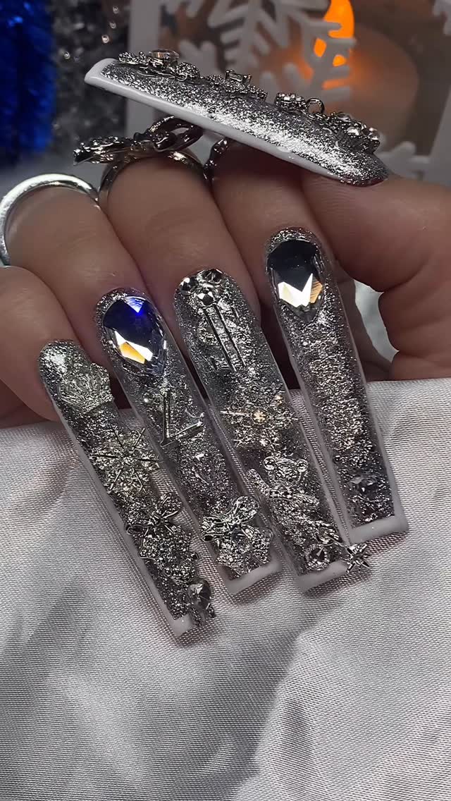 Instagram post by @nailzbyrissxo for Bluestreak Crystals. Caption reads: “Candy Cane Glitz” ❄️🎄

Using @bluestreakcrystals....