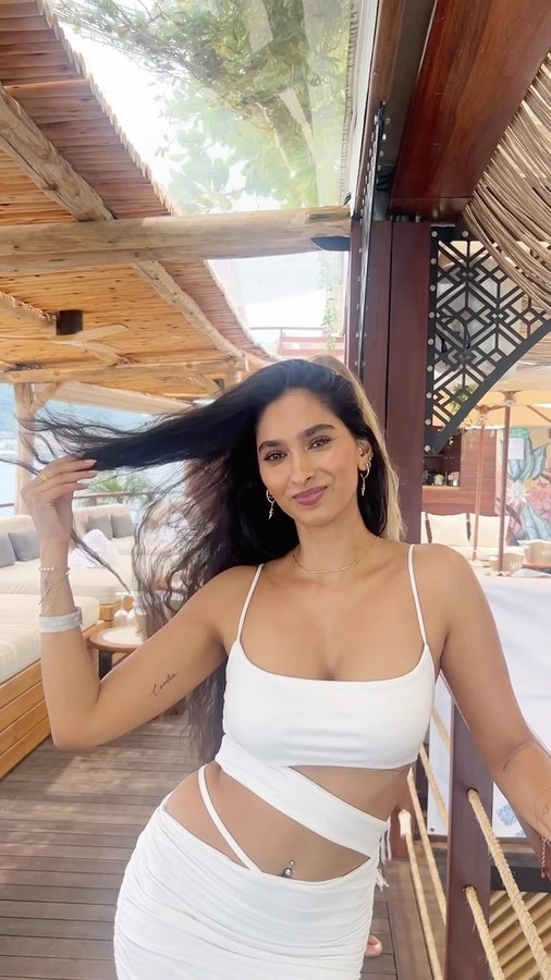 Instagram post by @nimznemisha for Belvedere Vodka. Caption reads: @yonabeach x @belvederevodka 🤍
#invited....