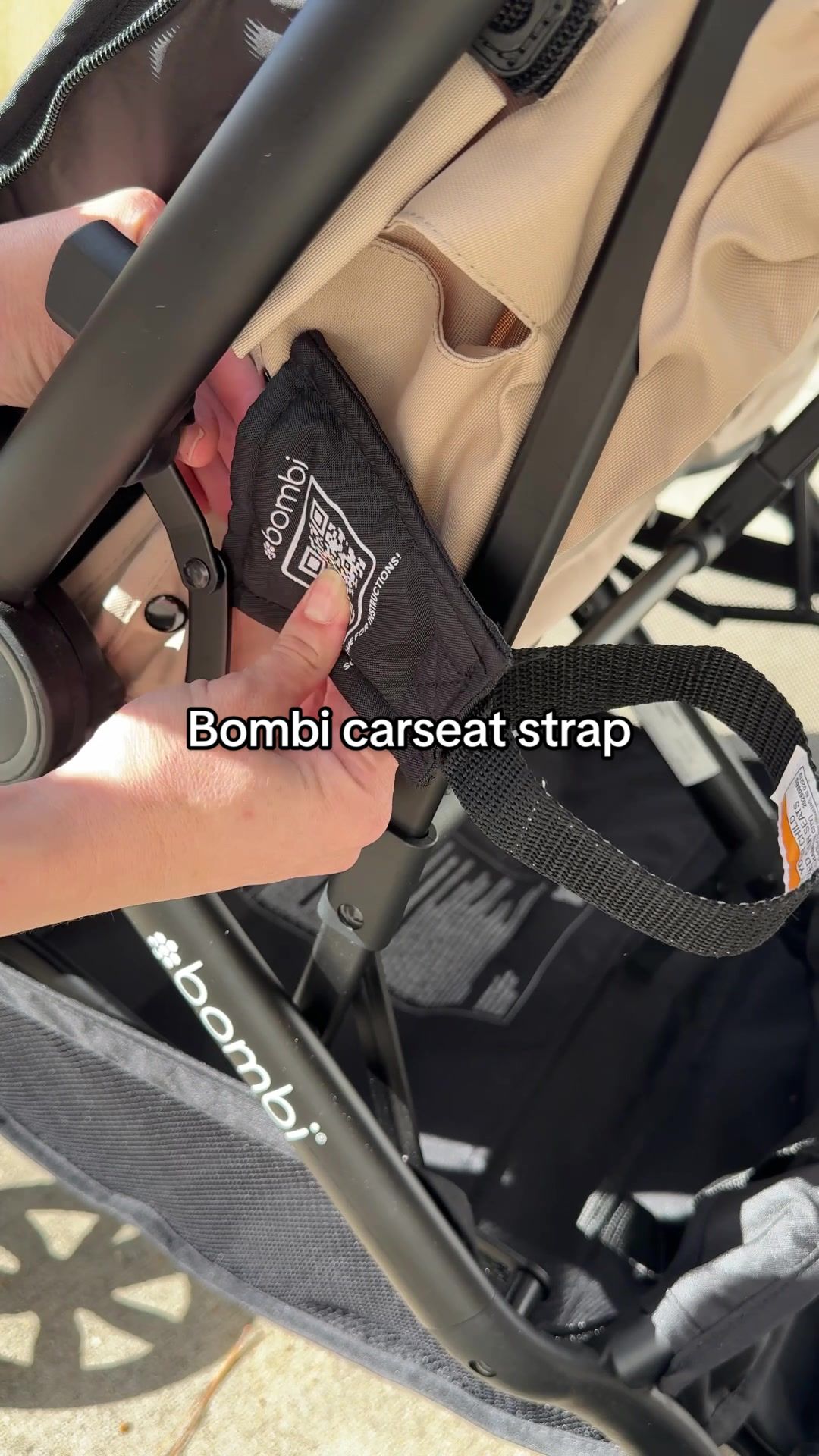 TikTok post by @whitneys_wheelhouse for Bombi Gear. Caption reads: [...] #bombi #doublestroller #carseatstrap @Bombi....