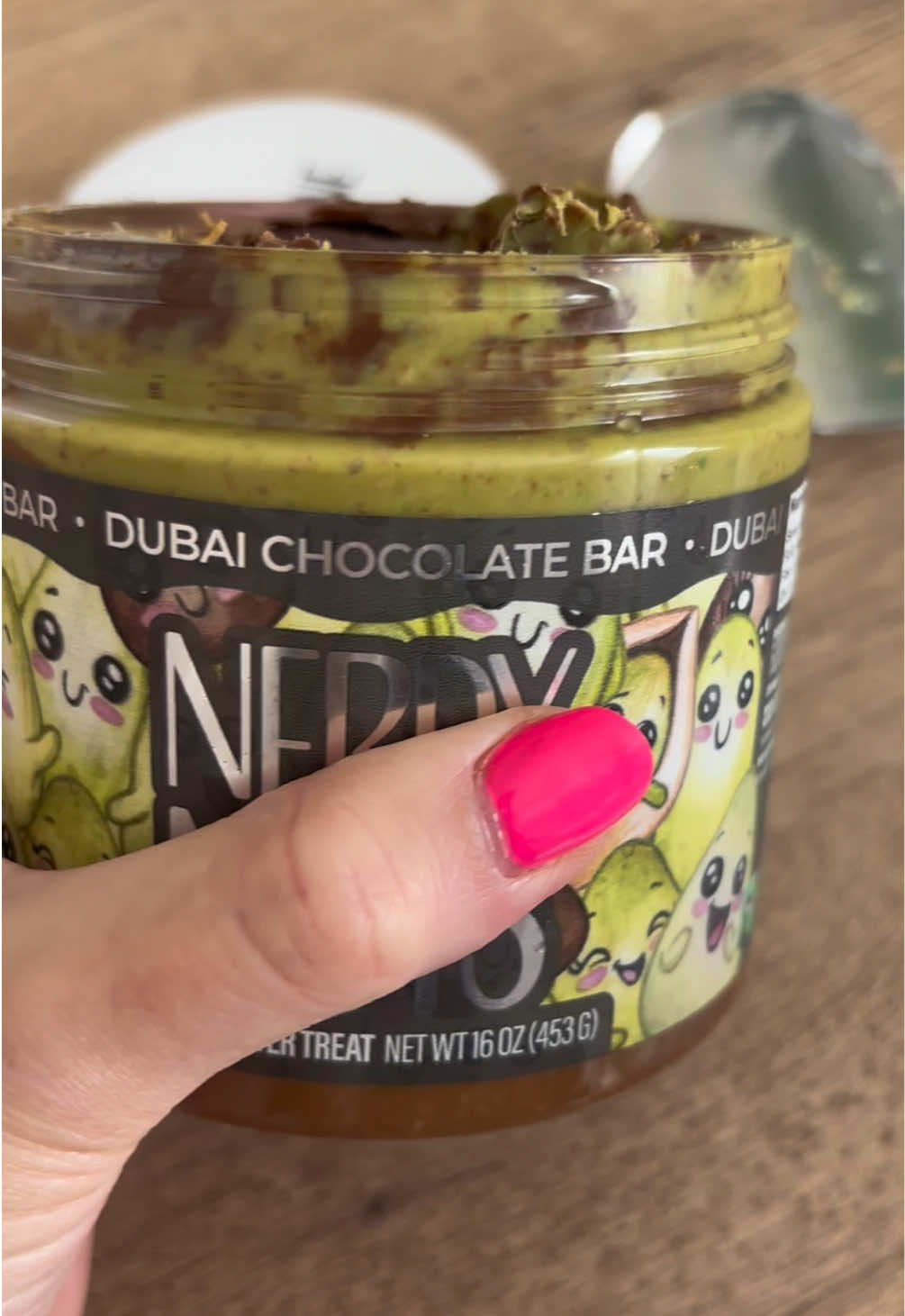 TikTok post by @christy.asmr for Nerdy Nuts. Caption reads: [...] else are you supposed to eat it?! #NerdyNuts....