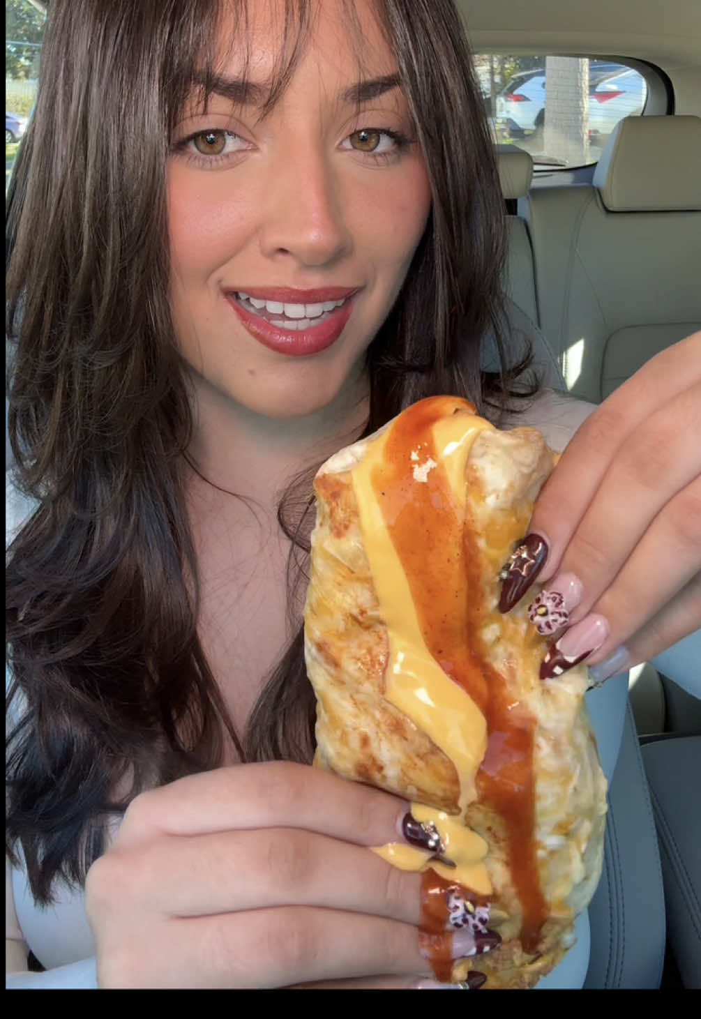 TikTok post by @cabreranali for Taco Bell. Caption reads: @tacobell mukbang after a haircut 🥰 what do we....