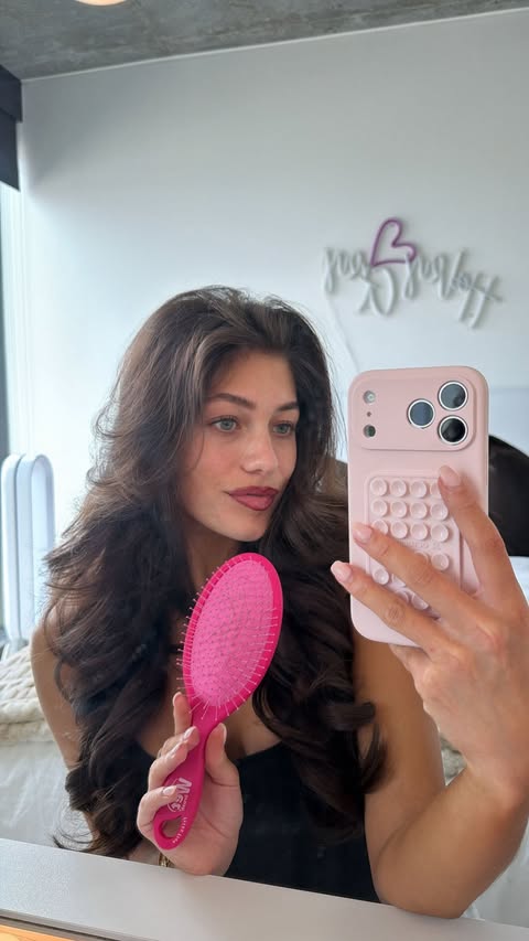 Instagram post by @haleysluss for Wet Brush. Caption reads: Keeping my hair frizz free using @thewetbrush....