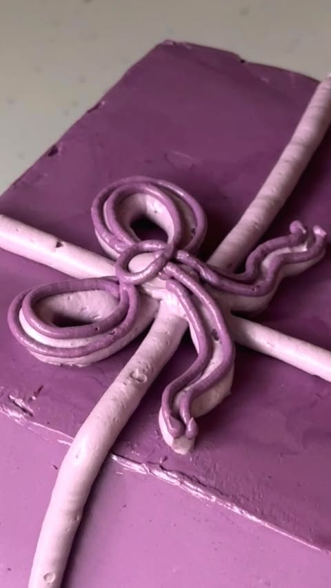 Instagram post by @katies_little_bakery for Liberty London. Caption reads: almond cake + blueberry mousse + mango white....