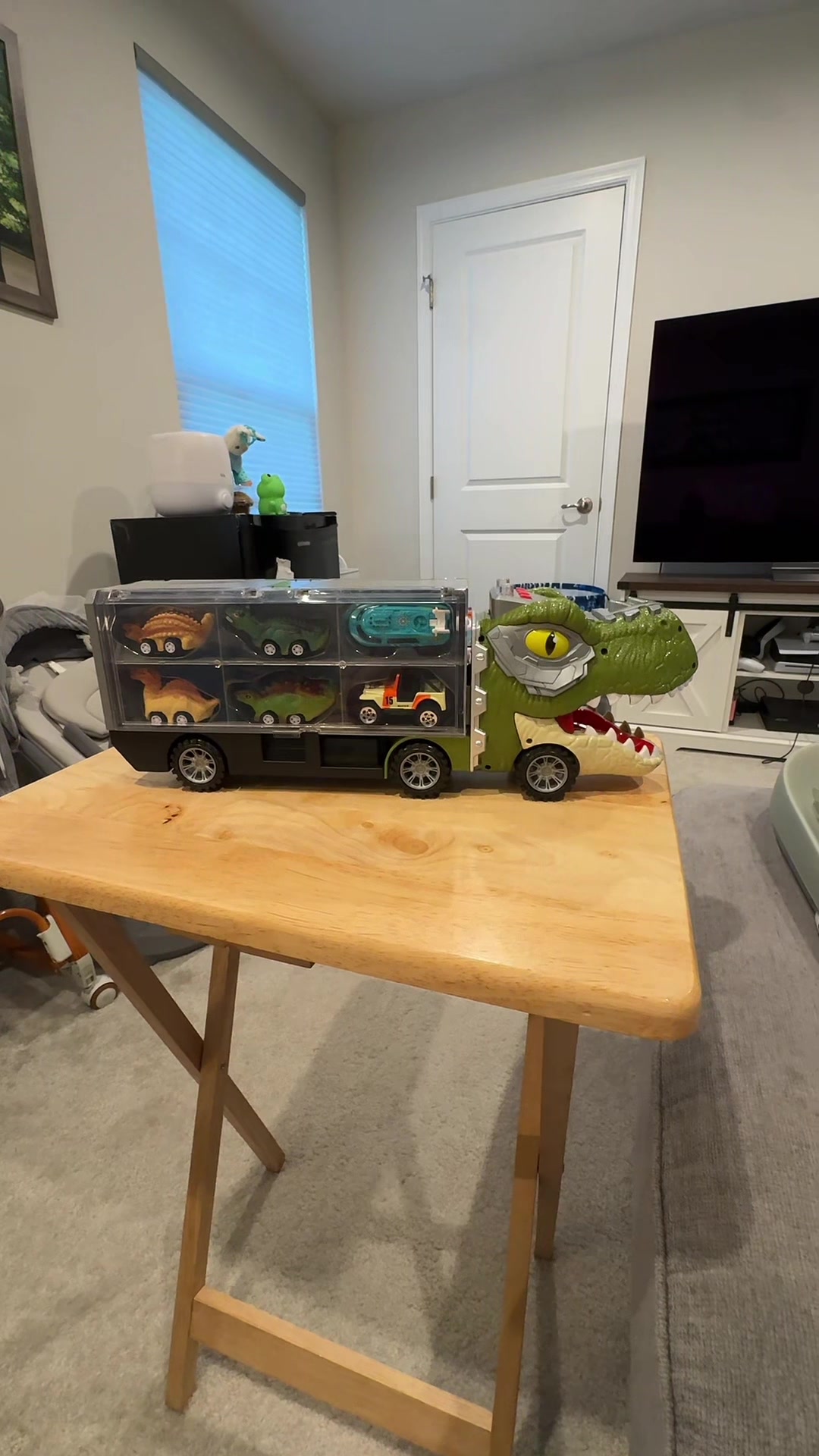 TikTok post by @shop.with.alainee for Joyfy. Caption reads: [...] truck carrier with 12 vehicles #joyin....