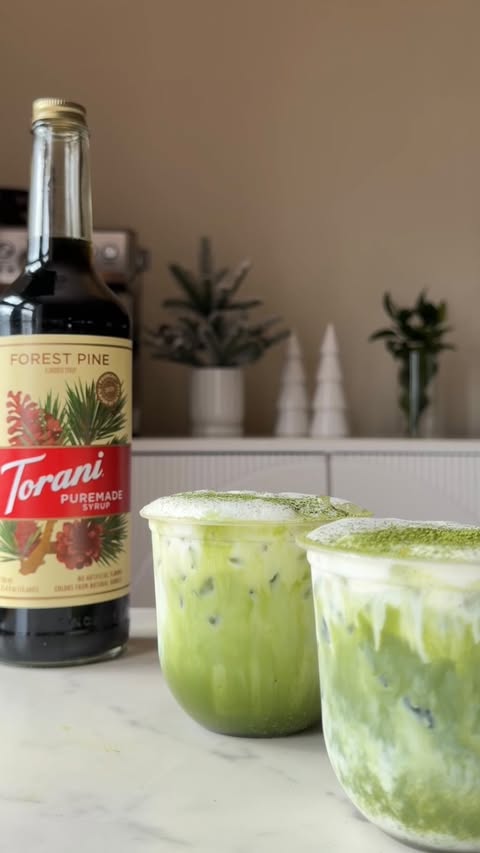 Instagram post by @coffeewithrafaela for Torani. Caption reads: Pine Honey Matcha 🍵🌲💚✨
Discover Torani’s 2026....