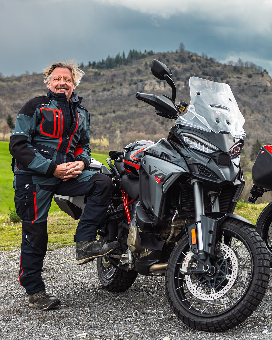Instagram post by @andreacicarossi for Ducati. Caption reads: Ride along with Charley Boorman and the Ducati....