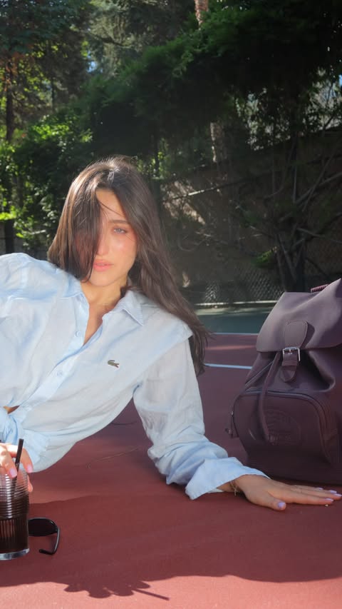 Instagram post by @yasemincem1 for Lacoste. Caption reads: @lacoste on repeat this fall 🐊 #vintageback [...].