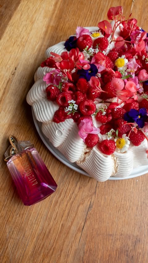 Instagram post by @georgieeats for The Perfume Shop. Caption reads: [...] by @muglerofficial 💖 #fragrance....