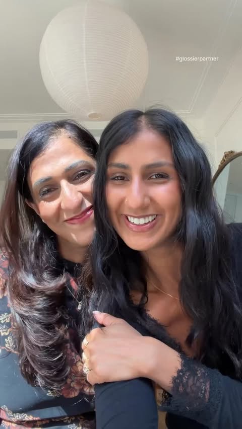 Instagram post by @tanyaslehria for Glossier. Caption reads: GRWM (+ my mom) using @glossier Boy Brow 🩷 one....