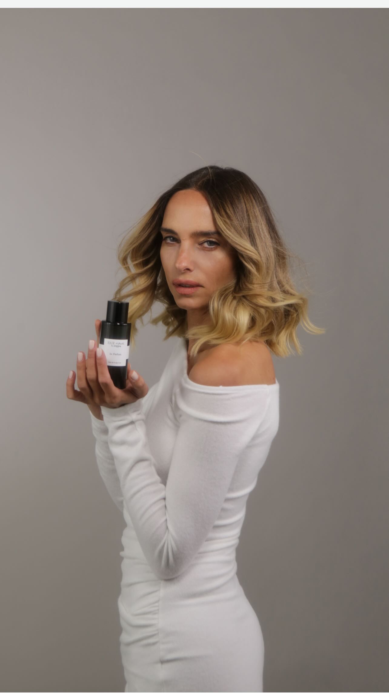 Instagram post by @candela_________ for Hair Rituel by Sisley. Caption reads: . Hair Rituel by Sisley Le Parfum. An evocative....