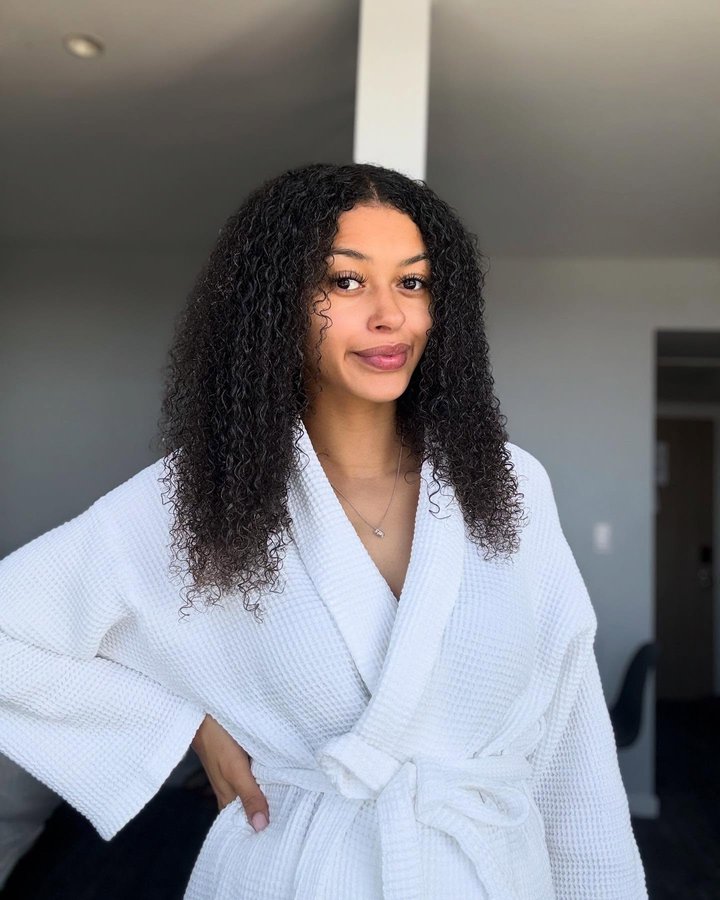 Instagram post by @temikaskye__ for NATURTINT. Caption reads: Embracing my curls with @naturtintuk new curly....