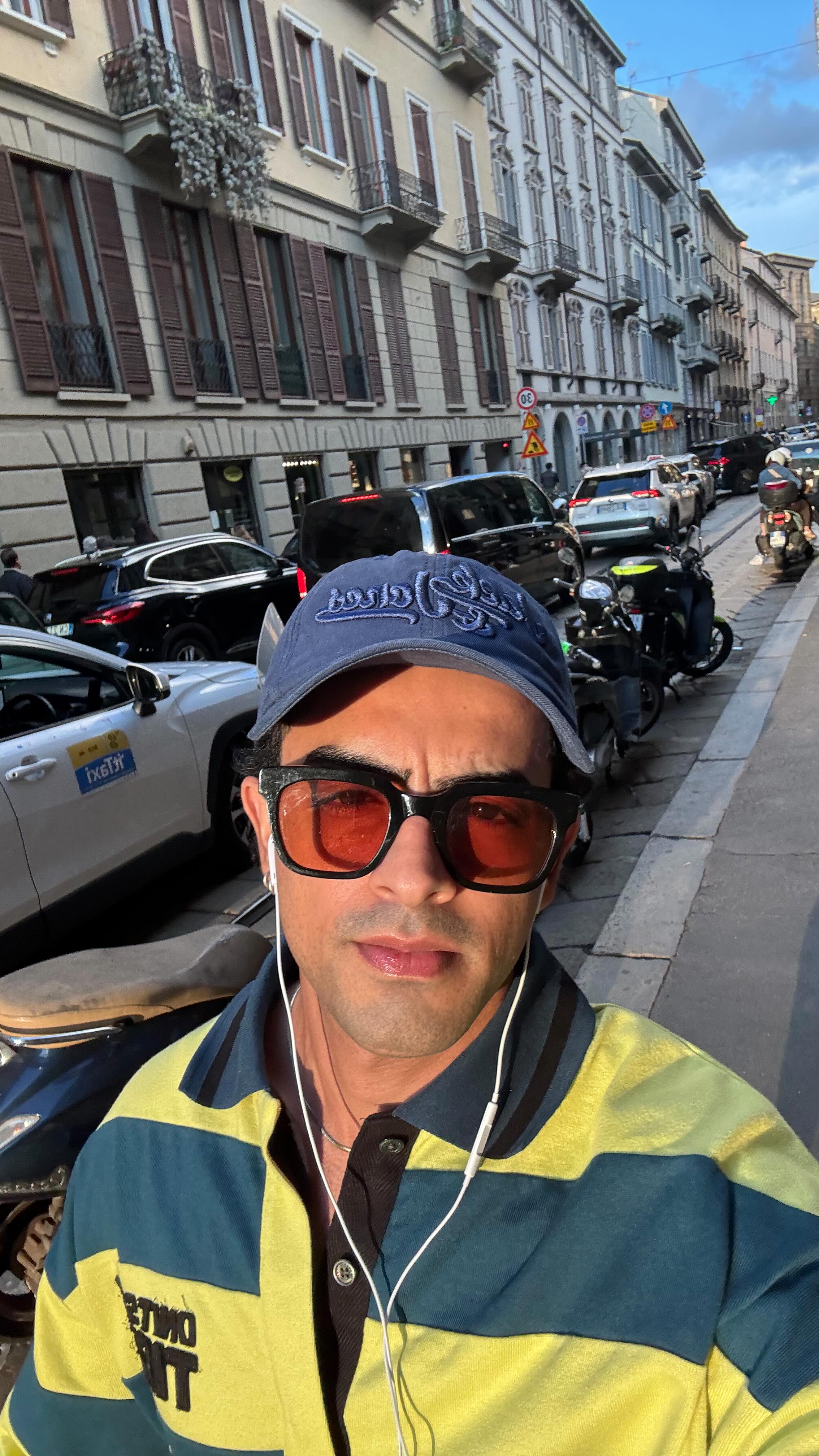 Instagram post by @sankett25 for Onitsuka Tiger. Caption reads: Just a casual day in milan during #MFW 🛵.