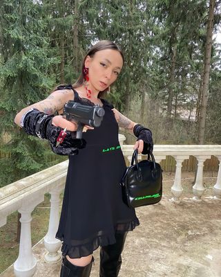 Instagram post by @dressedforspacee for Hypebae. Caption reads: Your every move is under control, baby🔪.