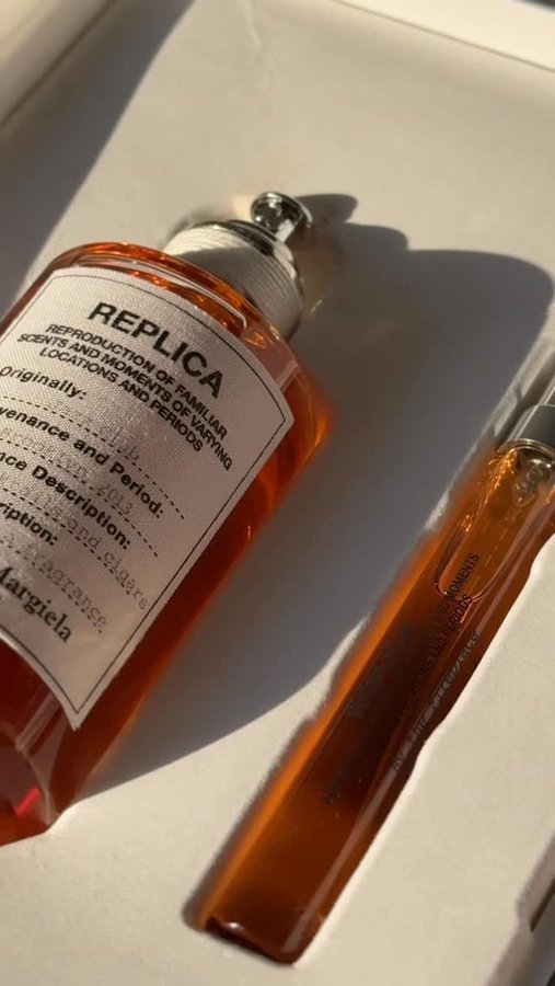 Instagram post by @redmone_ for Maison Margiela Fragrances. Caption reads: The warmth of smoky nights and the elegance of....