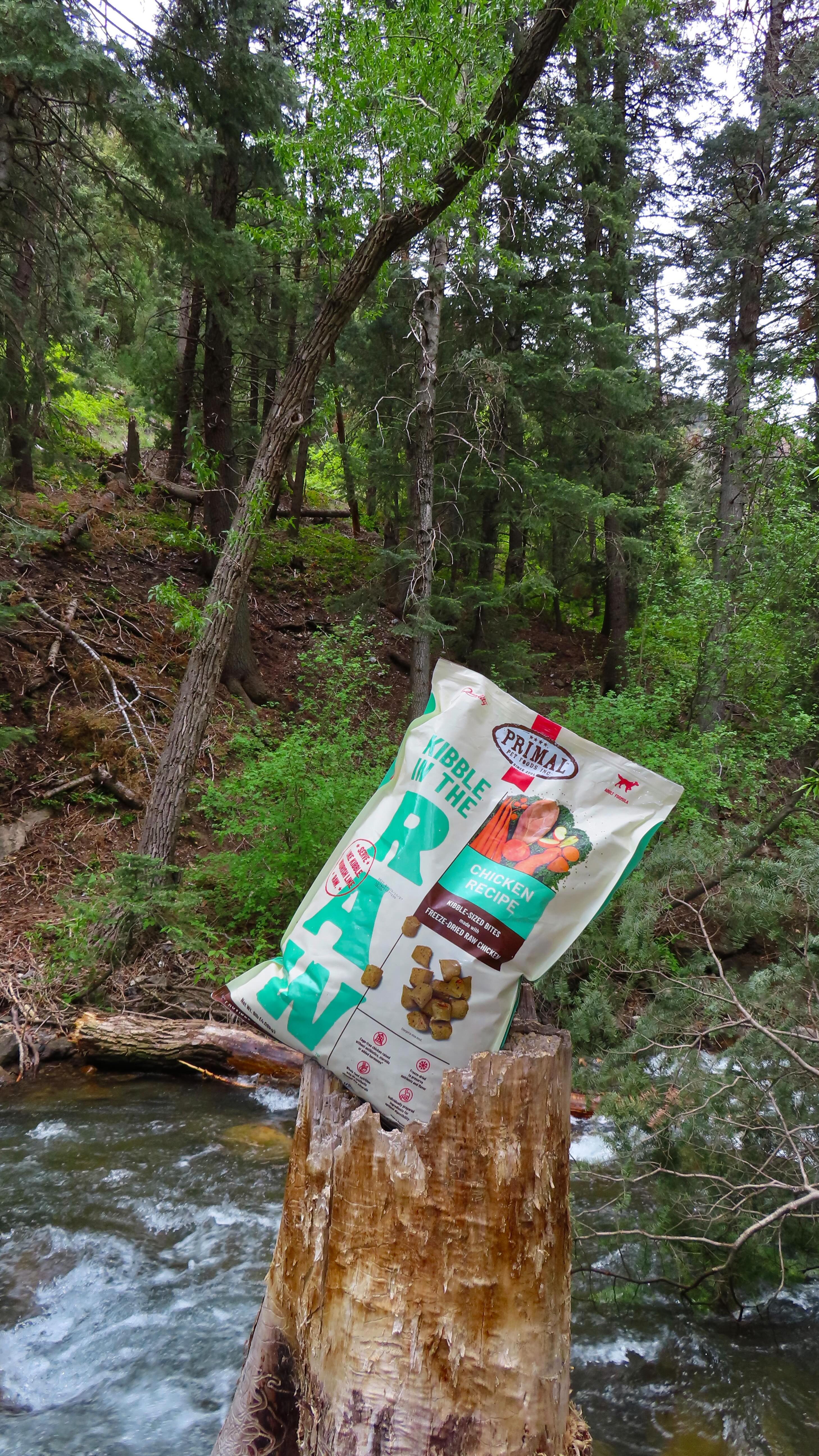 Instagram post by @_lizajoan for Primal Pet Foods. Caption reads: Dinner in the mountains with clean ingredients in....