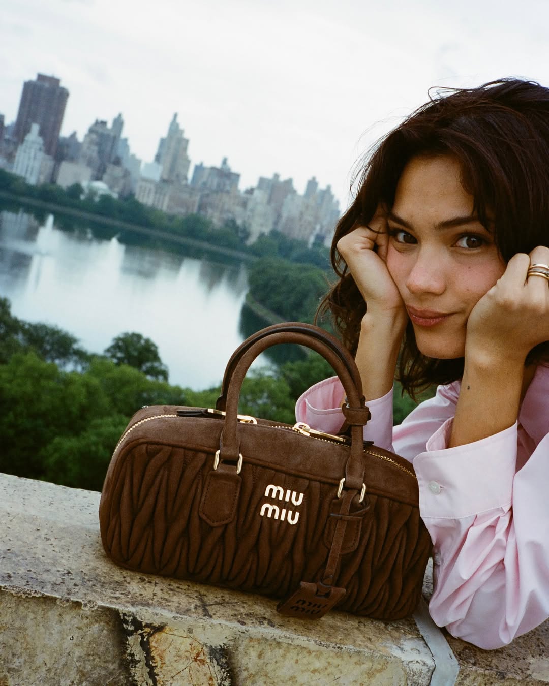 Instagram post by @yesly for Miu Miu. Caption reads: me and my miu miu @miumiu....