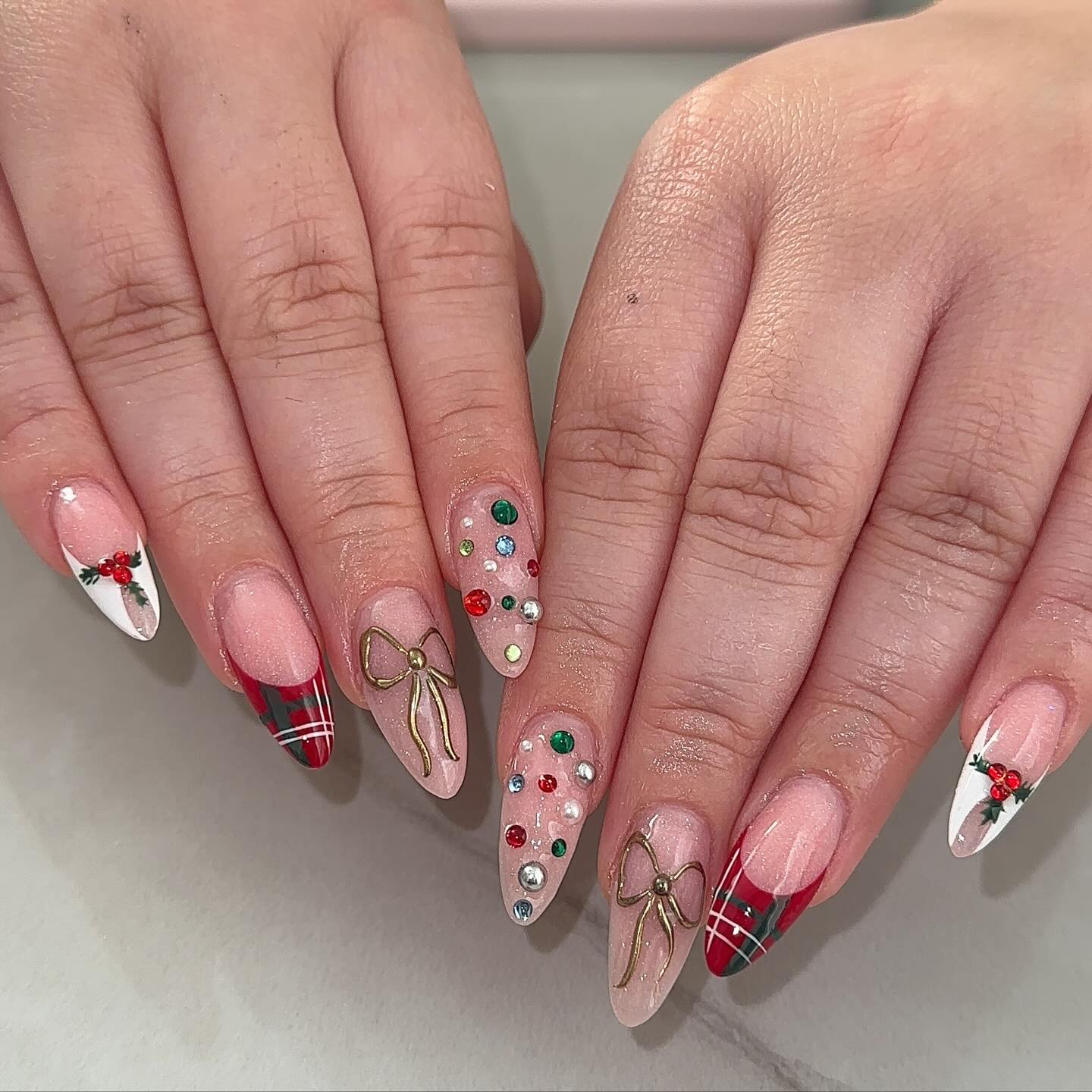 Instagram post by @nailssbynancy for VBeautyPure. Caption reads: [...] christmas nails 💖🫶✨🎄🦢 @vbeautypure....