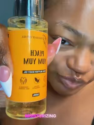 TikTok post by @keenastarks for Goddess of the Sea Beauty Bar. Caption reads: Peach Yum Yum Scented Body Oil Collection,....