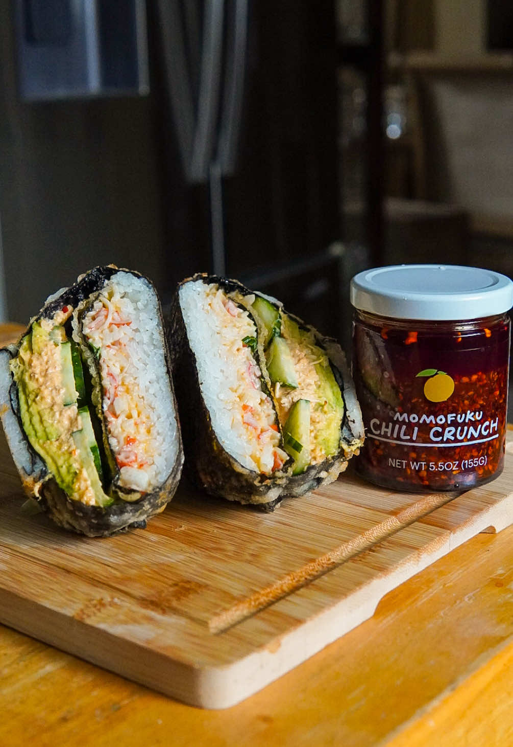 TikTok post by @soundsyum for Momofuku. Caption reads: [...] VIRAL Chili Crunch Sushi Dip made with....