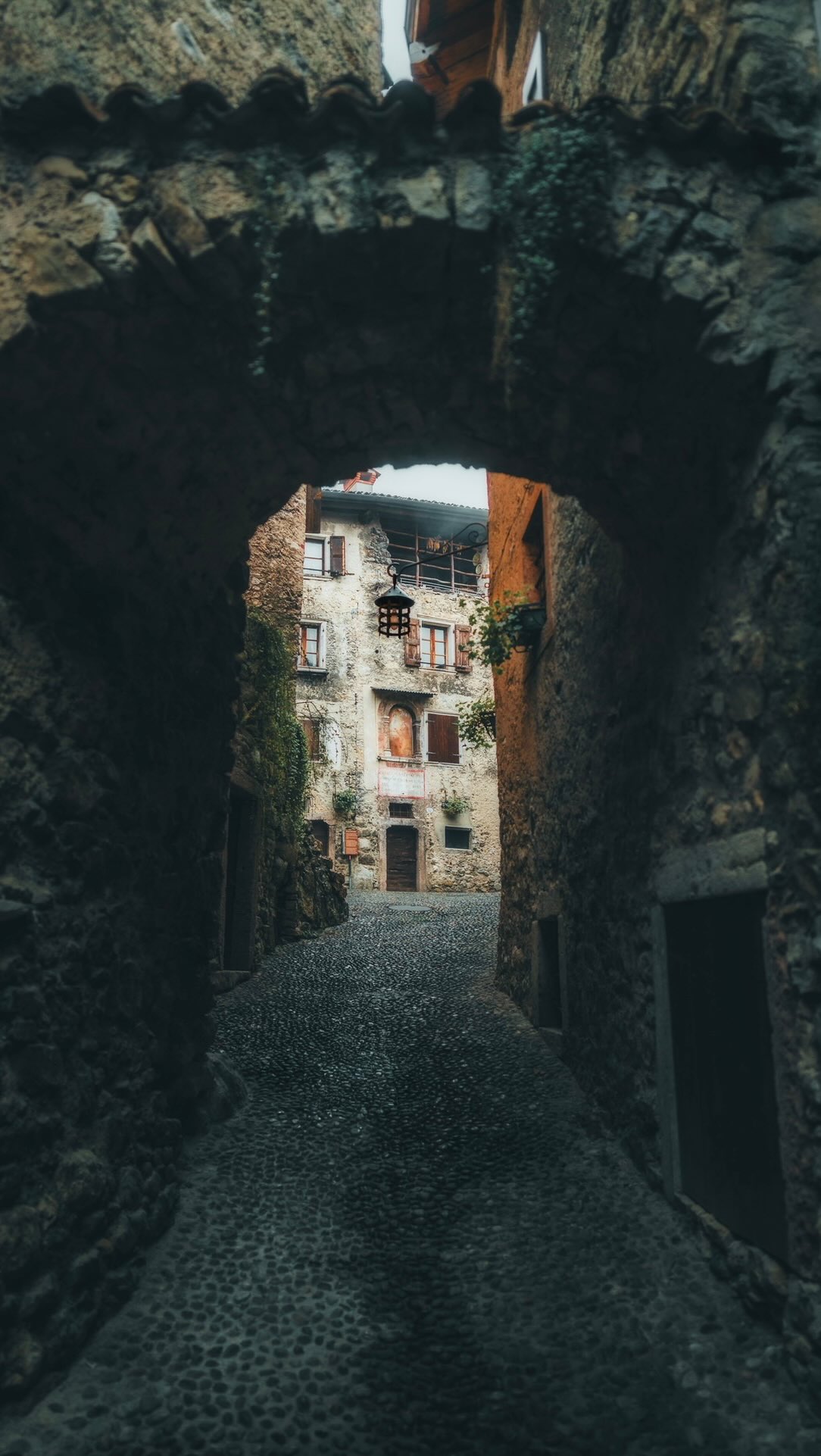 Instagram post by @giuliogroebert for Visit Trentino. Caption reads: [...] in the mountains above Lake Garda in....