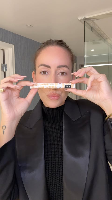 Instagram post by @melissaaizquierdo for IGK Hair. Caption reads: No flyaways allowed at the holiday party. 🥂✨....