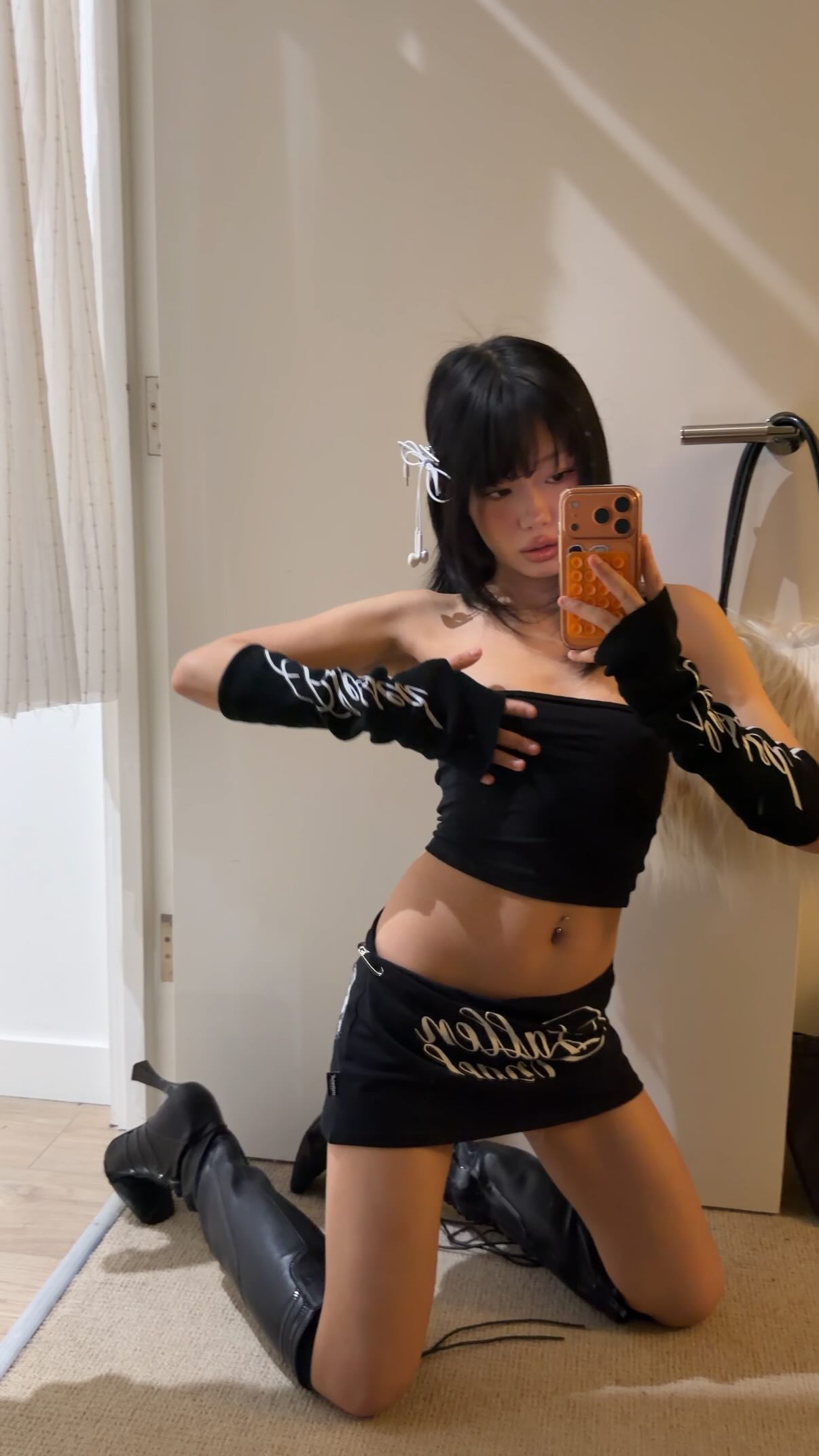 Instagram post by @nataliajiangg for Minga London. Caption reads: #ootd skirt & gloves & hair clip from @mingalondon....