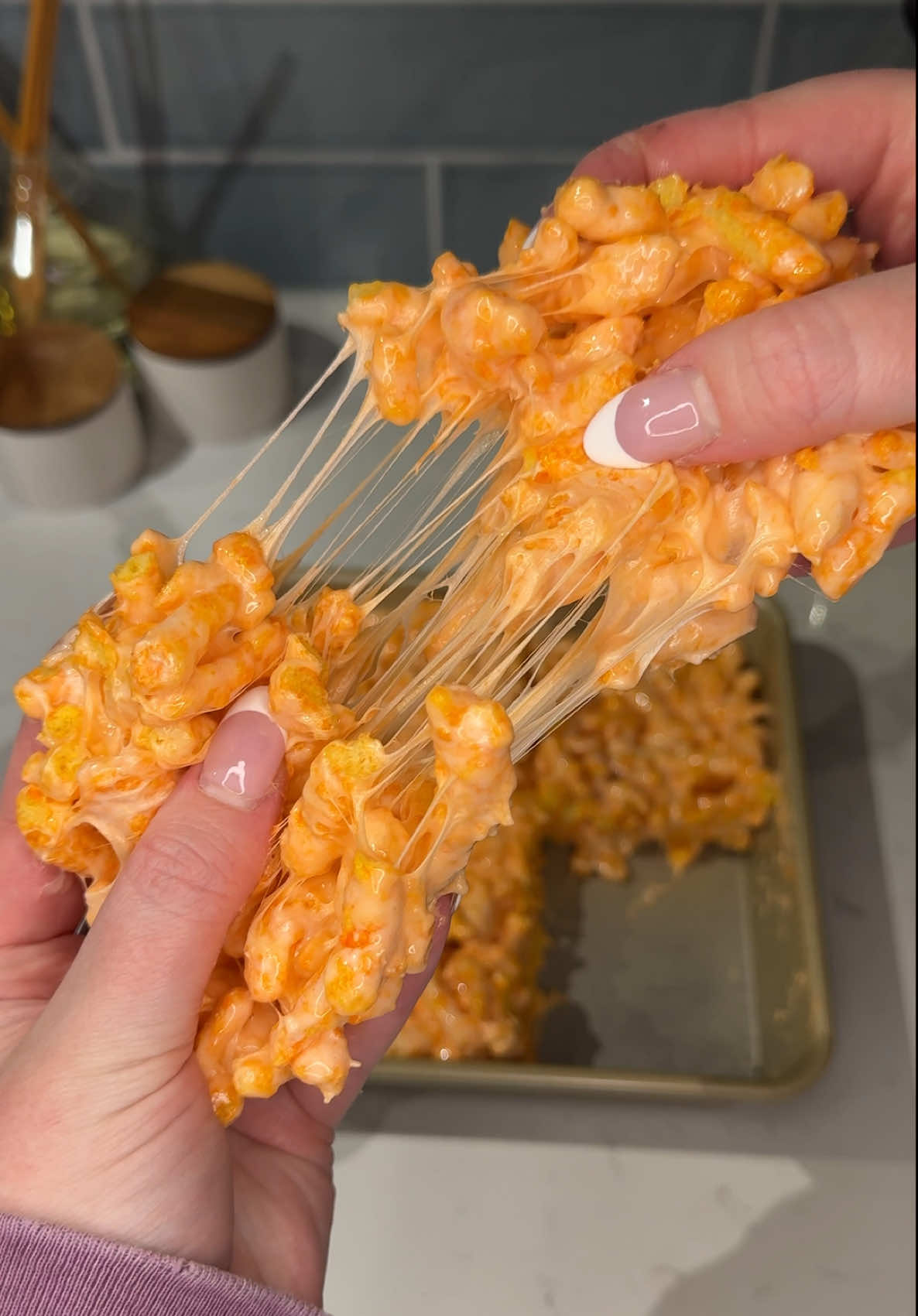 TikTok post by @ashleymarkleeats for Cheetos. Caption reads: someone tell me why these cheeto marshmallow....