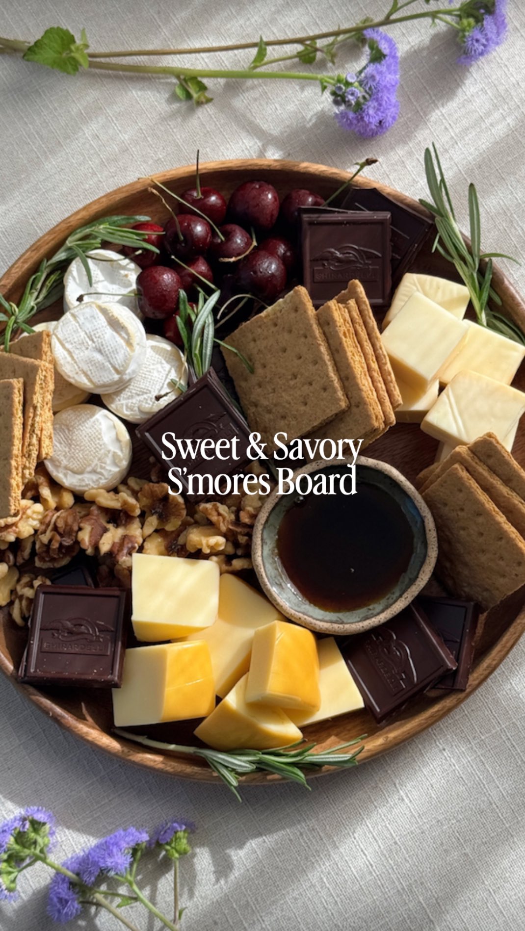 Instagram post by @thatcheeseplate for Ghirardelli. Caption reads: PRO TIP: Chocolate pairs with cheese far better....