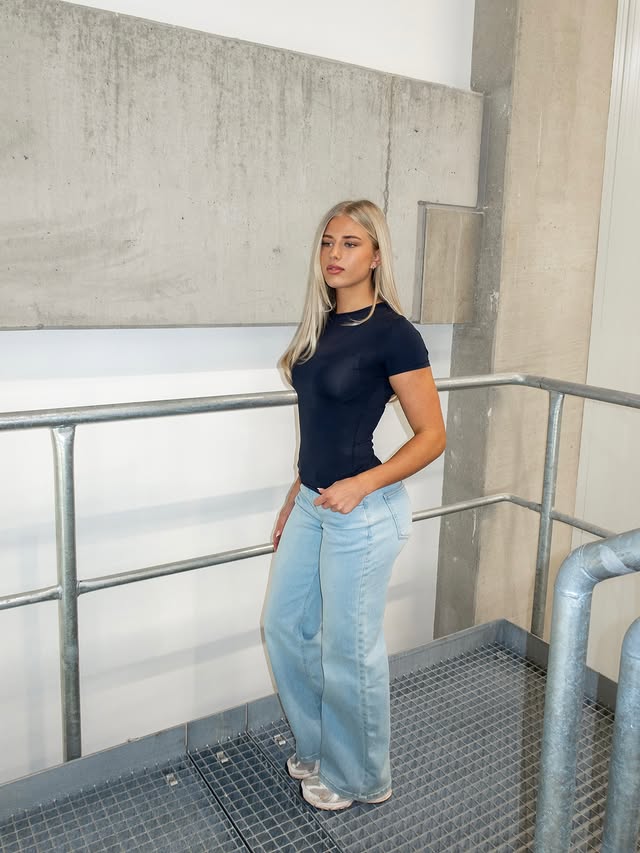 Instagram post by @elliemaackk for FITJEANS. Caption reads: Jeans and a tee always slays | @fitjeans May Sale....