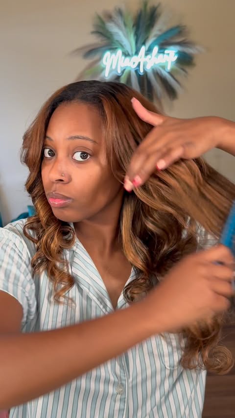 Instagram post by @miaa.ashantii for RevAir. Caption reads: Obsessed with the new @myrevair Micro Edge Styler....