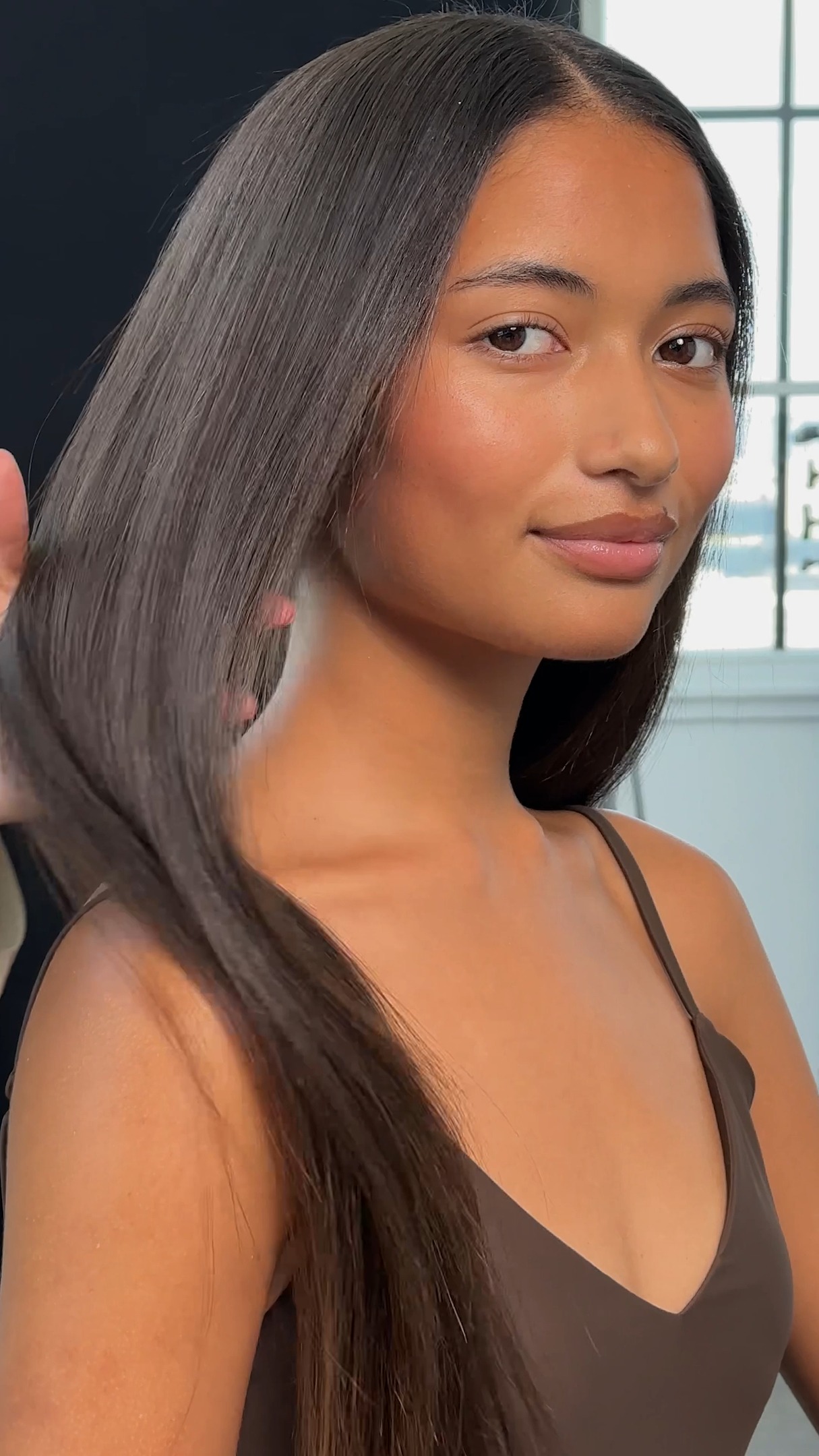 Instagram post by @jenelleno.5 for Oribe. Caption reads: When sleek meets chic. ✨ Global Artist....