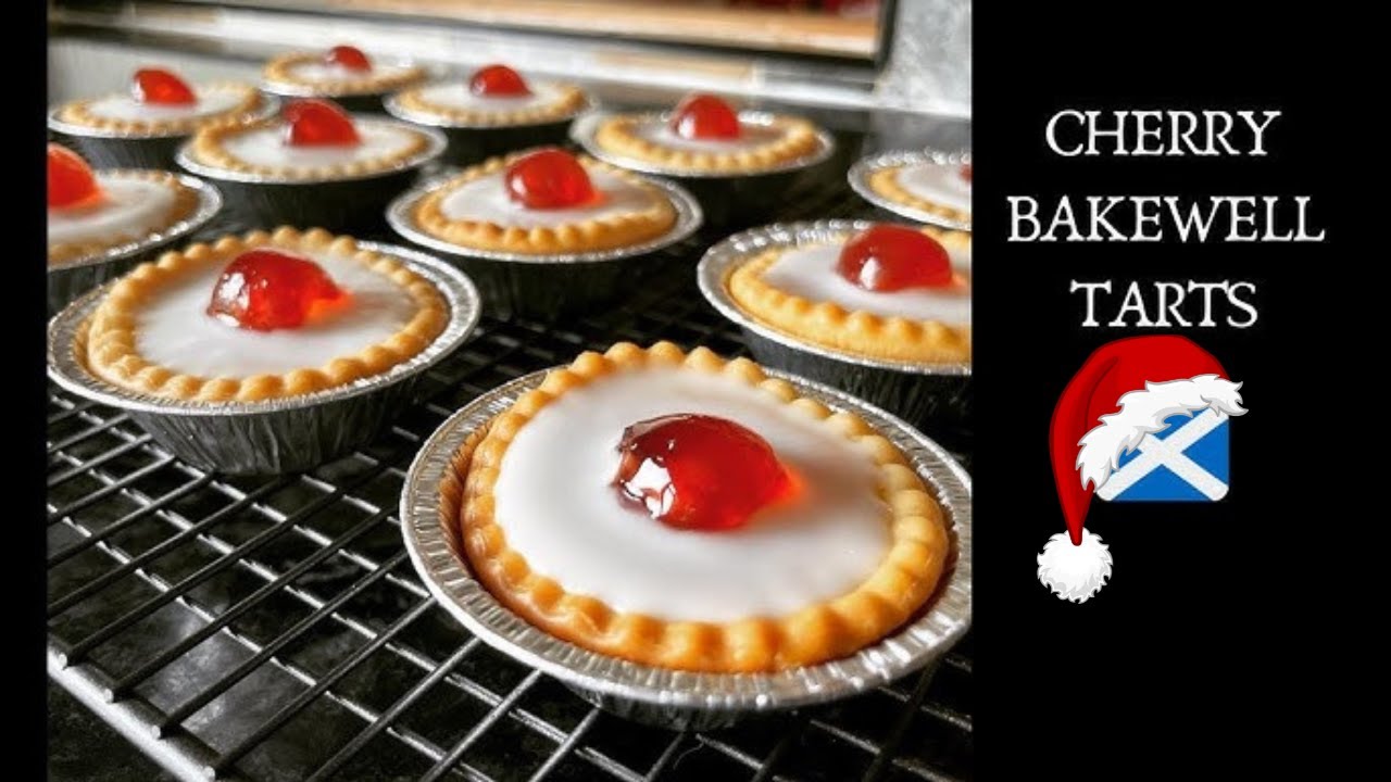 YouTube post by @WhatsForTea for Degusta Box. Caption reads: Classic Cherry Bakewell Tarts | Easy Recipe.