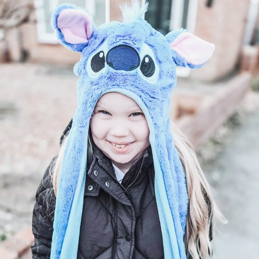 Instagram post by @mama_2_lola_priya for Mum & You. Caption reads: Stitch obsessed 💙 Lola keeping herself warm with....