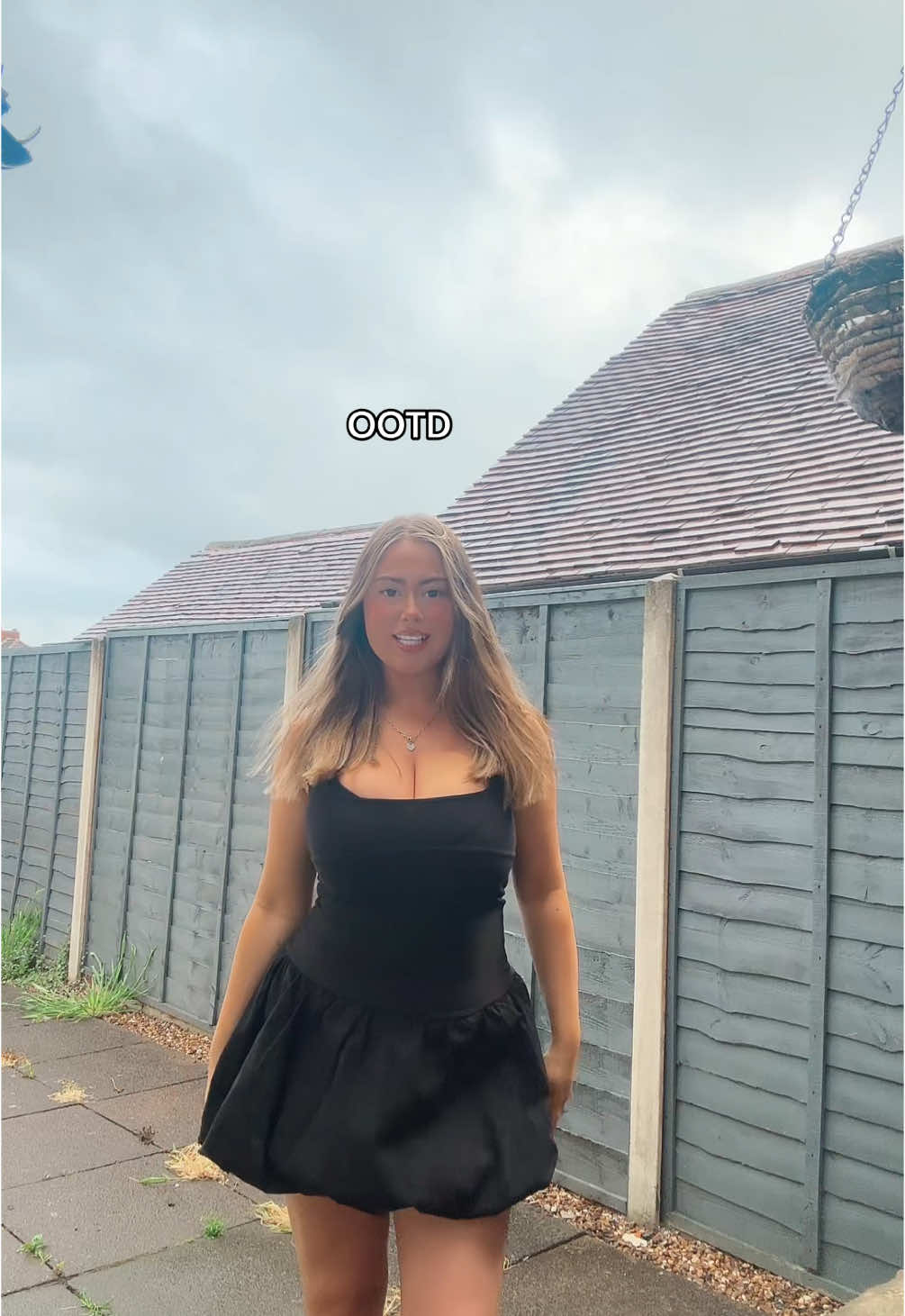 TikTok post by @sarahlightx for Rebellious Fashion. Caption reads: rain is a paid actor  Dress - @Rebellious Fashion .