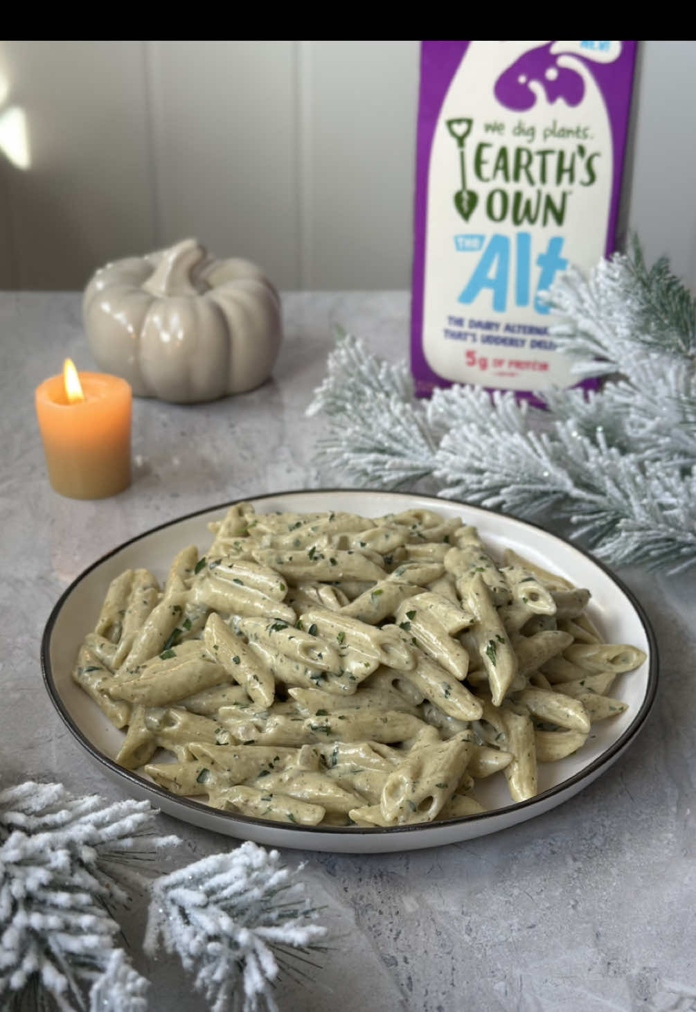 TikTok post by @majasrecipes for Earth’s Own. Caption reads: Creamy Pesto Pasta (vegan)✨ @EarthsOwn FULL RECIPE....