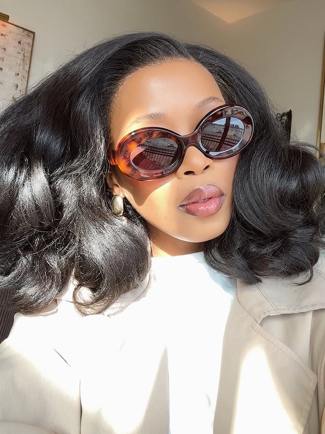 Instagram post by @lwethu_mcusi for JustFab. Caption reads: Let’s catch up. 🗑️ #justfabpartner #justfabstyle....