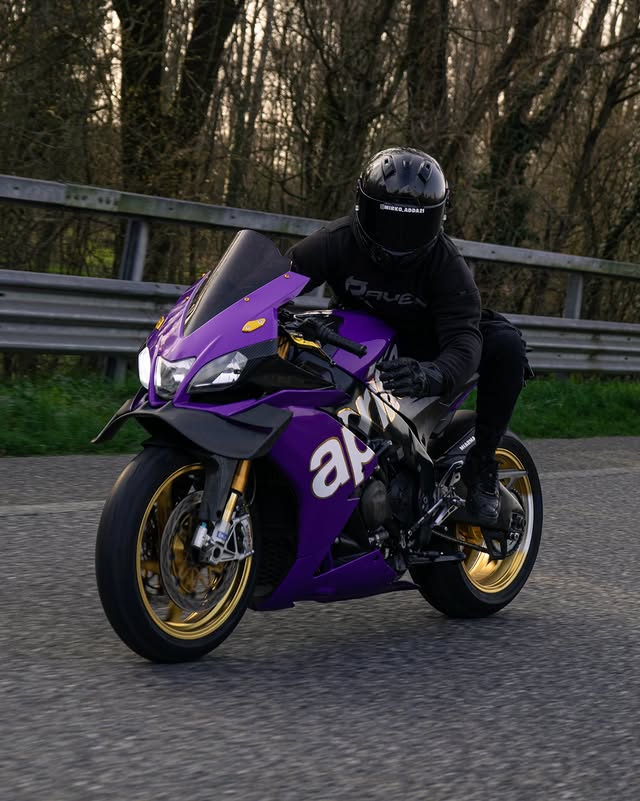 Instagram post by @adda_21_rsv4 for RAVEN Moto. Caption reads: 💜 Protect yourself with @ravenmoto....