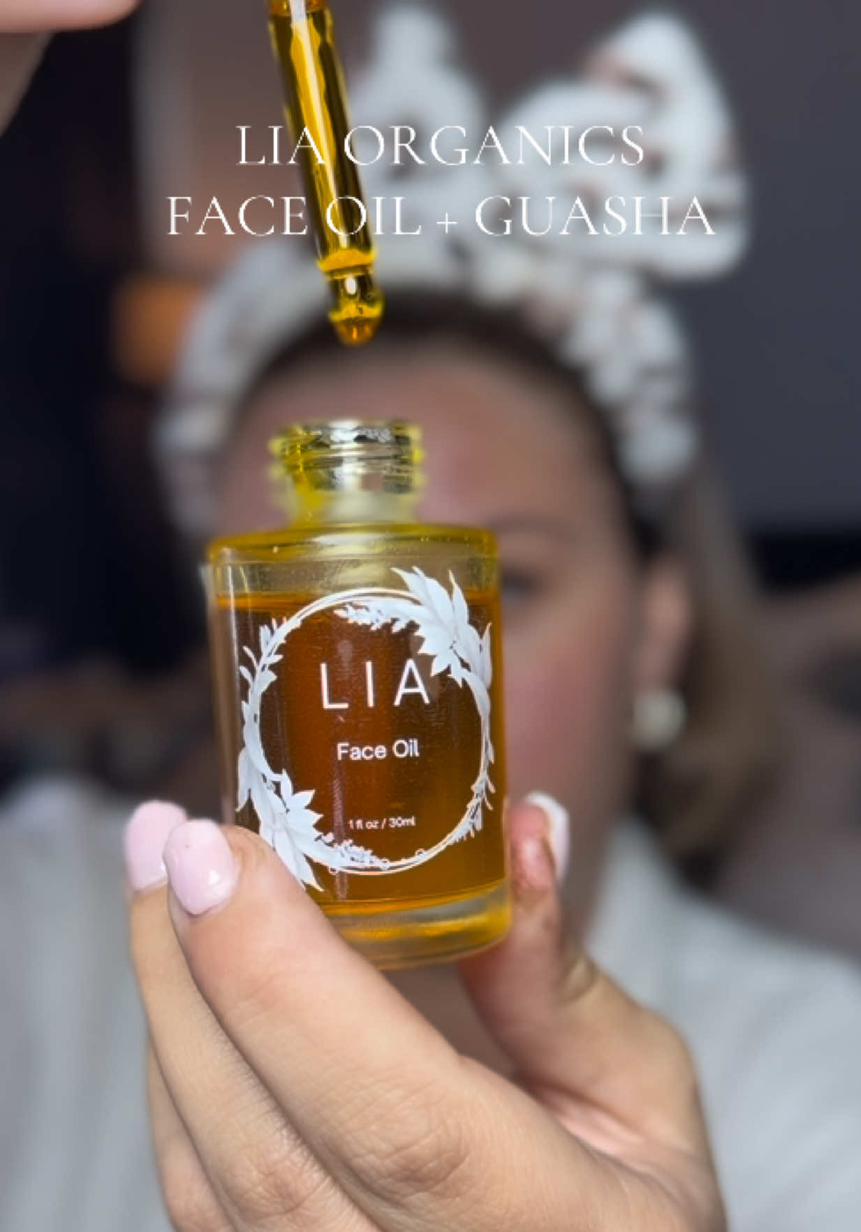 TikTok post by @sasssysadie for LIA Organics. Caption reads: @LIA Organics 🍃 face oil routine 💕 All Natural....