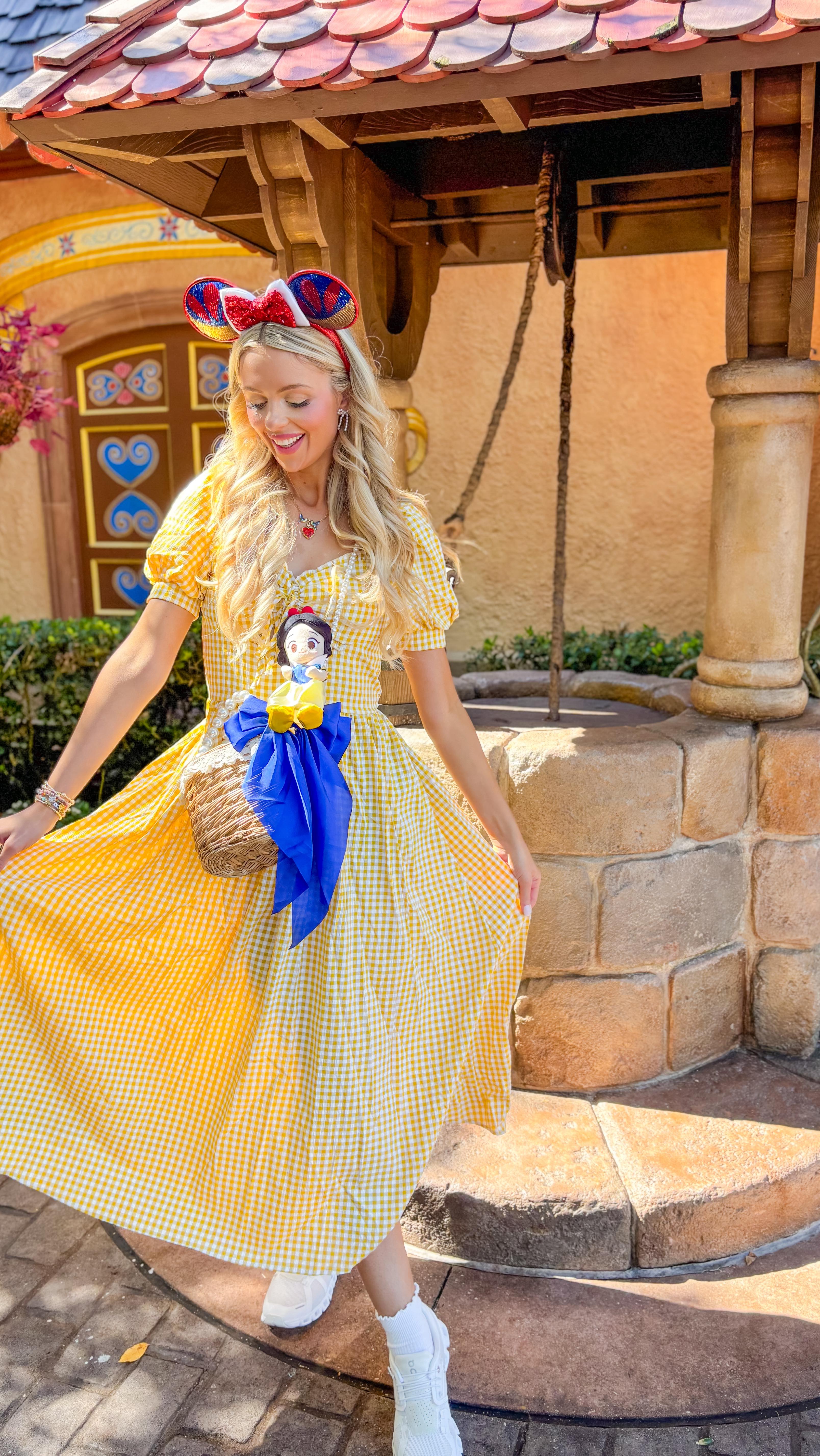 Instagram post by @emilyyyrosess for Little Words Project. Caption reads: Snow White Disney bound for Epcot🍎🌼👑 Outfit....