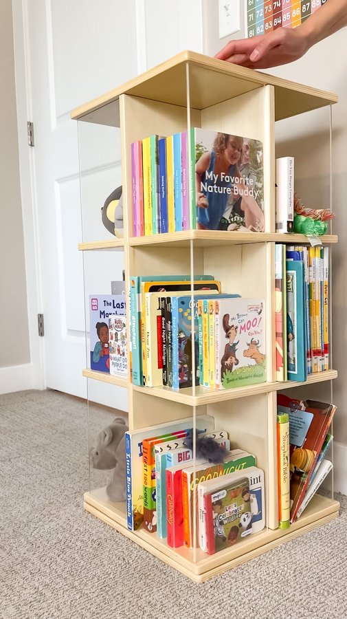 Instagram post by @a.calm.mom for Guidecraft. Caption reads: [...] for storage, this rotating shelf from....