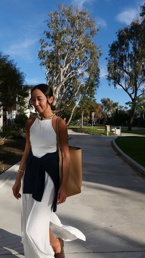 Instagram post by @lanitonnu for Beyond Yoga. Caption reads: This Linen Halter Dress from @beyondyoga is a....