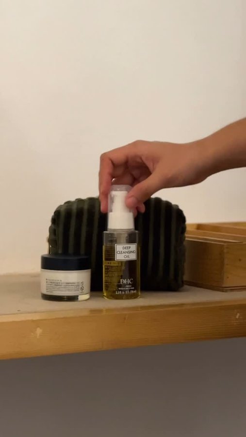 Instagram post by @pom_lyf for DHC. Caption reads: • a product review: @dhcbeautyindia oil cleanser •....