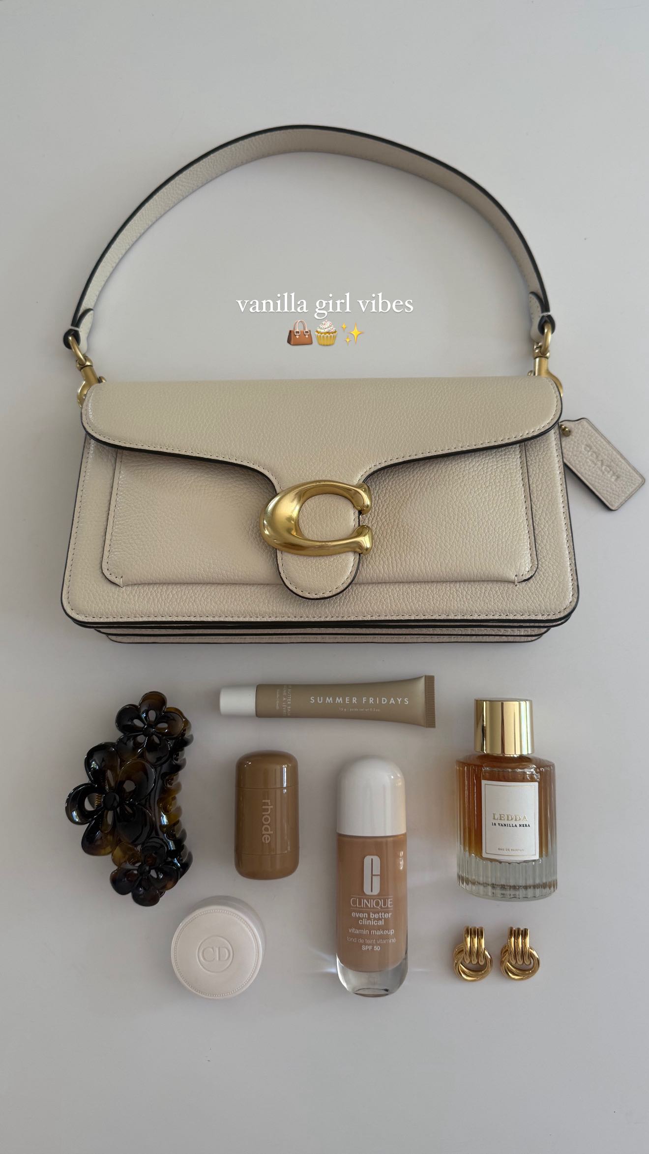Instagram post by @carrieanne_ for Rhode Skin. Caption reads: vanilla girl bag picks 👜🧁✨

@coach @cliniqueuk*....