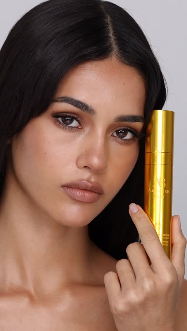 Instagram post by @hindash for Augustinus Bader. Caption reads: The ULTIMATE Vitamin C Serum. Even under makeup.....