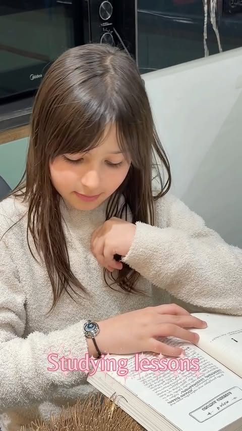 Instagram post by an influencer for totwoo Smart Jewelry. Caption reads: My mini-me, my strength, my light 🫂🌸 @totwoo Go....