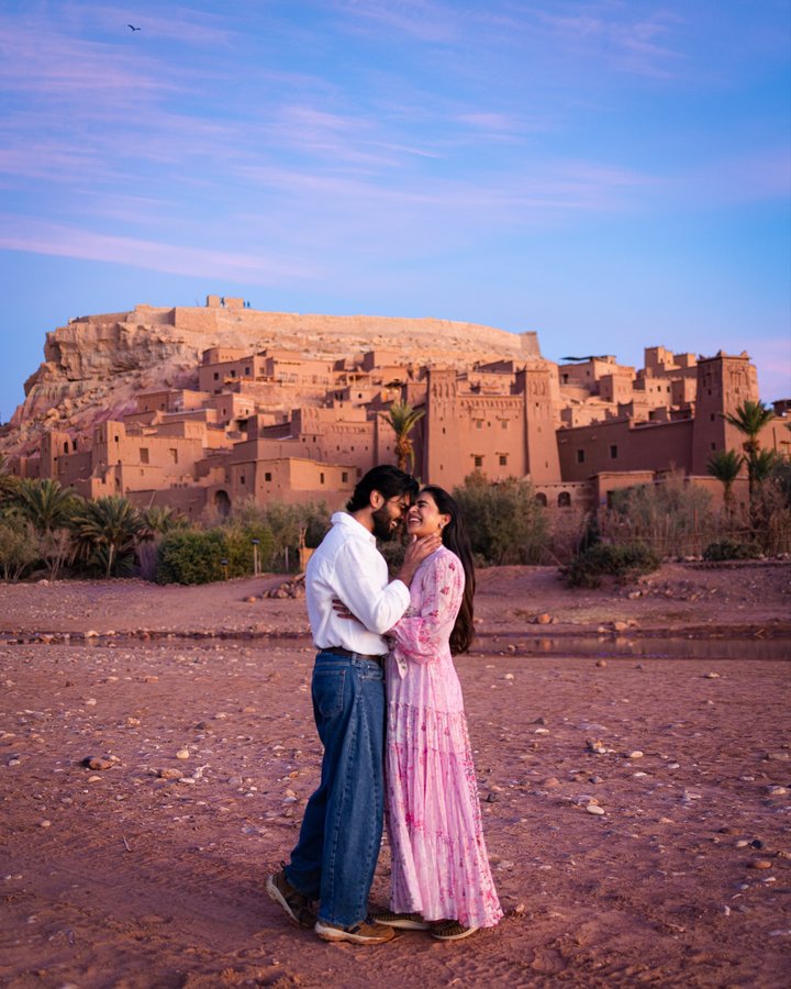 Instagram post by @odysseyoftwo for GT Holidays. Caption reads: From blue hour to golden hour, Aït Ben Haddou kept....