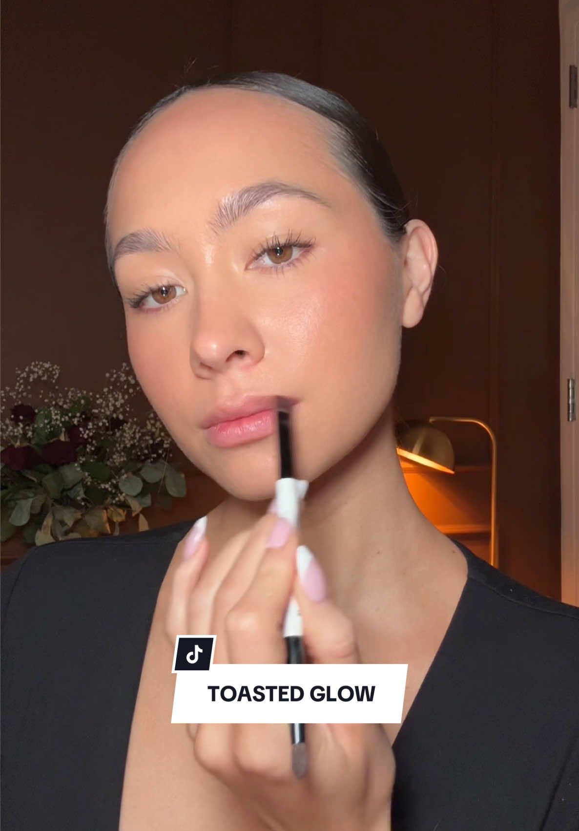 TikTok post by @zoekimkenealy for Chantecaille. Caption reads: Toasted girl on the go makeup routine. This look....