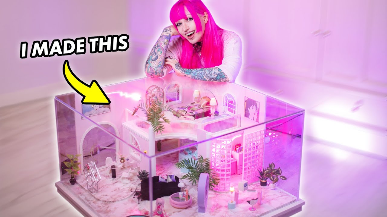 YouTube post by @MoonlightJewel for Koi Footwear. Caption reads: I Built a Miniature Mansion INSIDE a Coffee Table....
